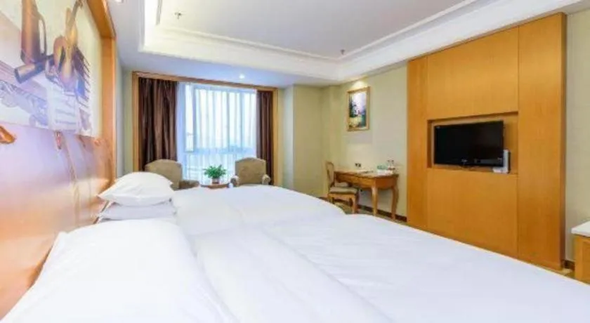 Bed in Vienna Hotel Nanning Anji Wanda 33rd Middle School Metro Station
