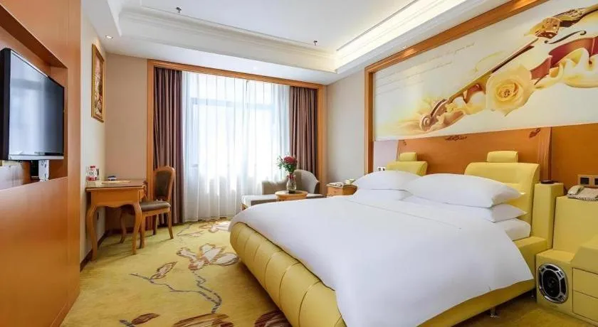 Bed in Vienna Hotel Nanning Anji Wanda 33rd Middle School Metro Station