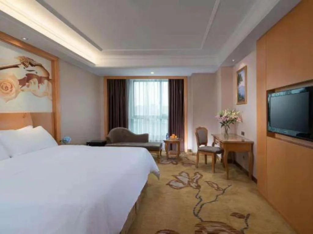 Bed in Vienna Hotel Nanning Anji Wanda 33rd Middle School Metro Station