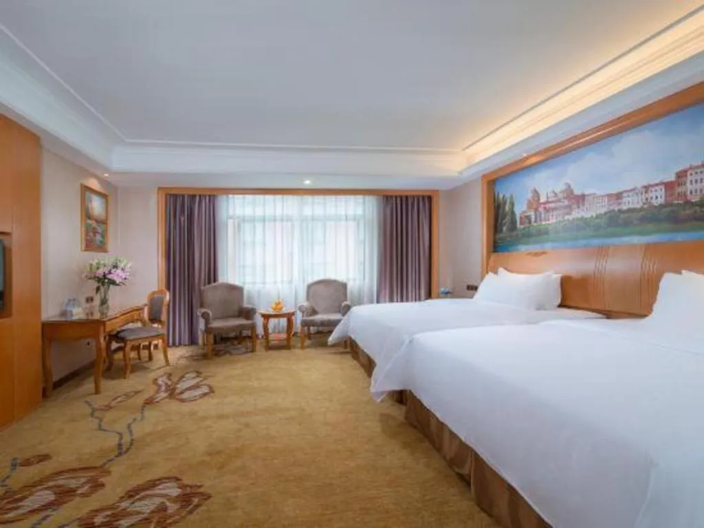 Bed in Vienna Hotel Nanning Anji Wanda 33rd Middle School Metro Station