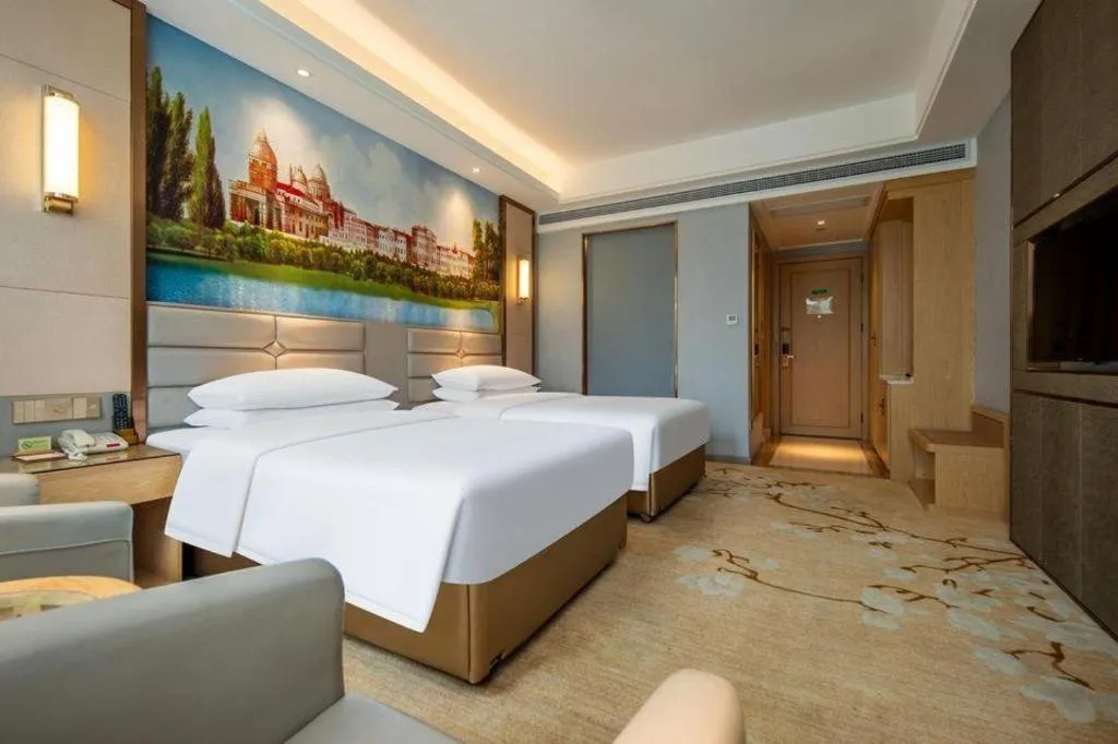 Bed in Vienna Hotel Wuhan Guobo Jiangang Metro Station