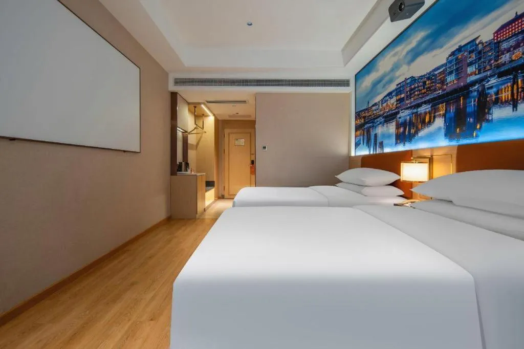 Bed in Vienna Hotel Wuhan Guobo Jiangang Metro Station