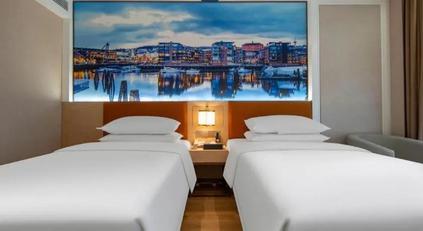 Bed in Vienna Hotel Wuhan Guobo Jiangang Metro Station