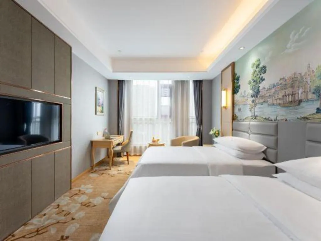 Bed in Vienna Hotel Wuhan Guobo Jiangang Metro Station