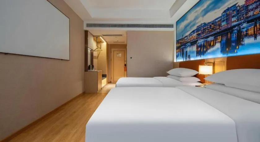 Bed in Vienna Hotel Wuhan Guobo Jiangang Metro Station