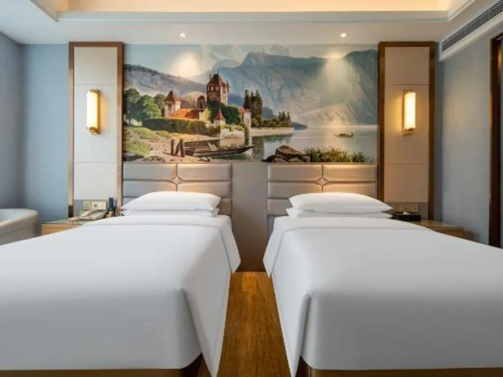 Bed in Vienna Hotel Wuhan Guobo Jiangang Metro Station