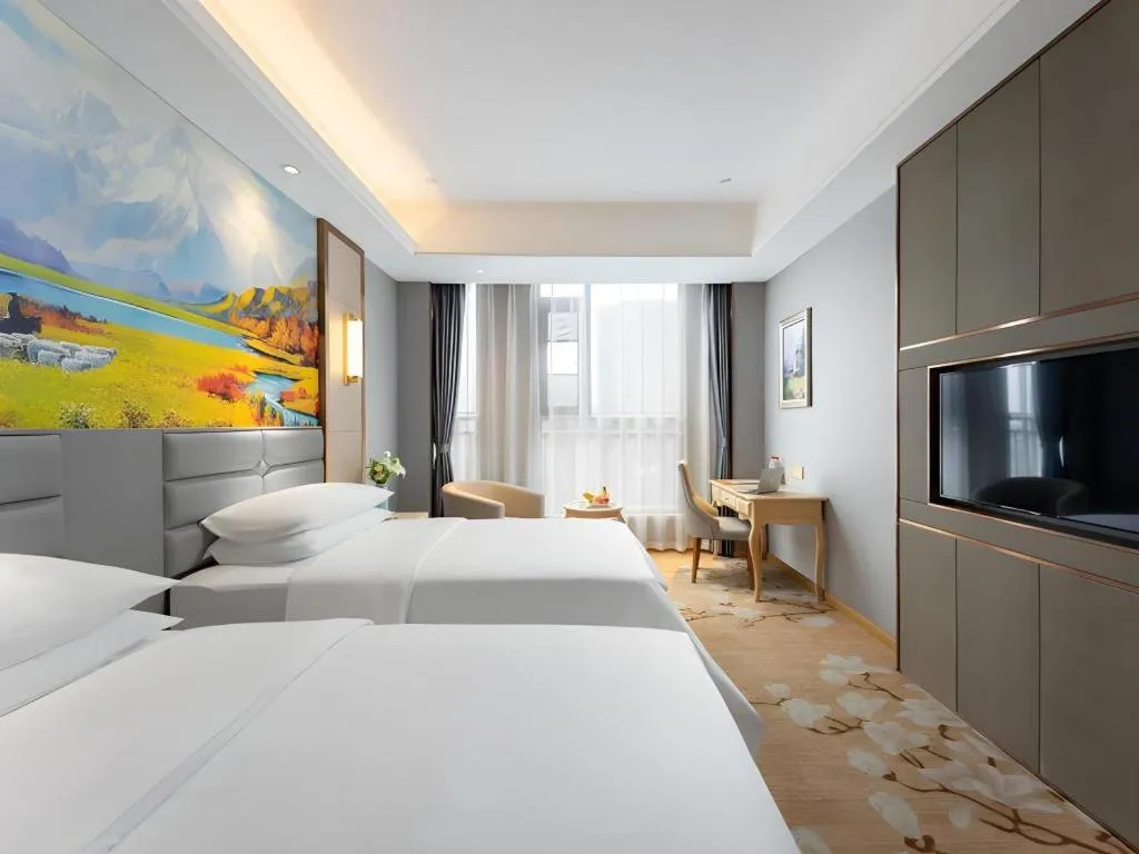 Bed in Vienna Hotel Wuhan Guobo Jiangang Metro Station