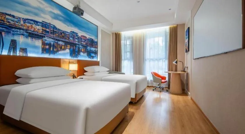 Bed in Vienna Hotel Wuhan Guobo Jiangang Metro Station