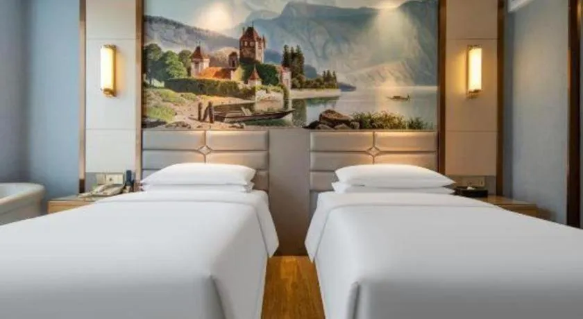 Bed in Vienna Hotel Wuhan Guobo Jiangang Metro Station