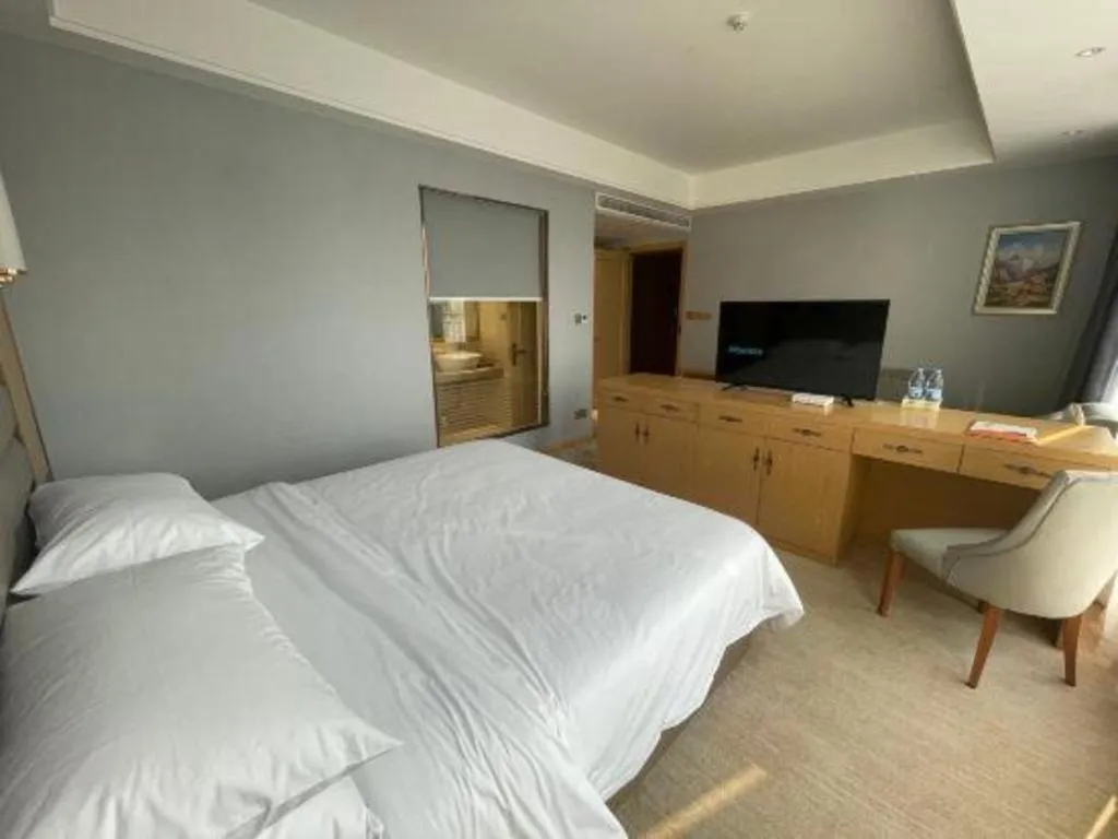 Bed in Vienna Hotel Wuhan Guobo Jiangang Metro Station