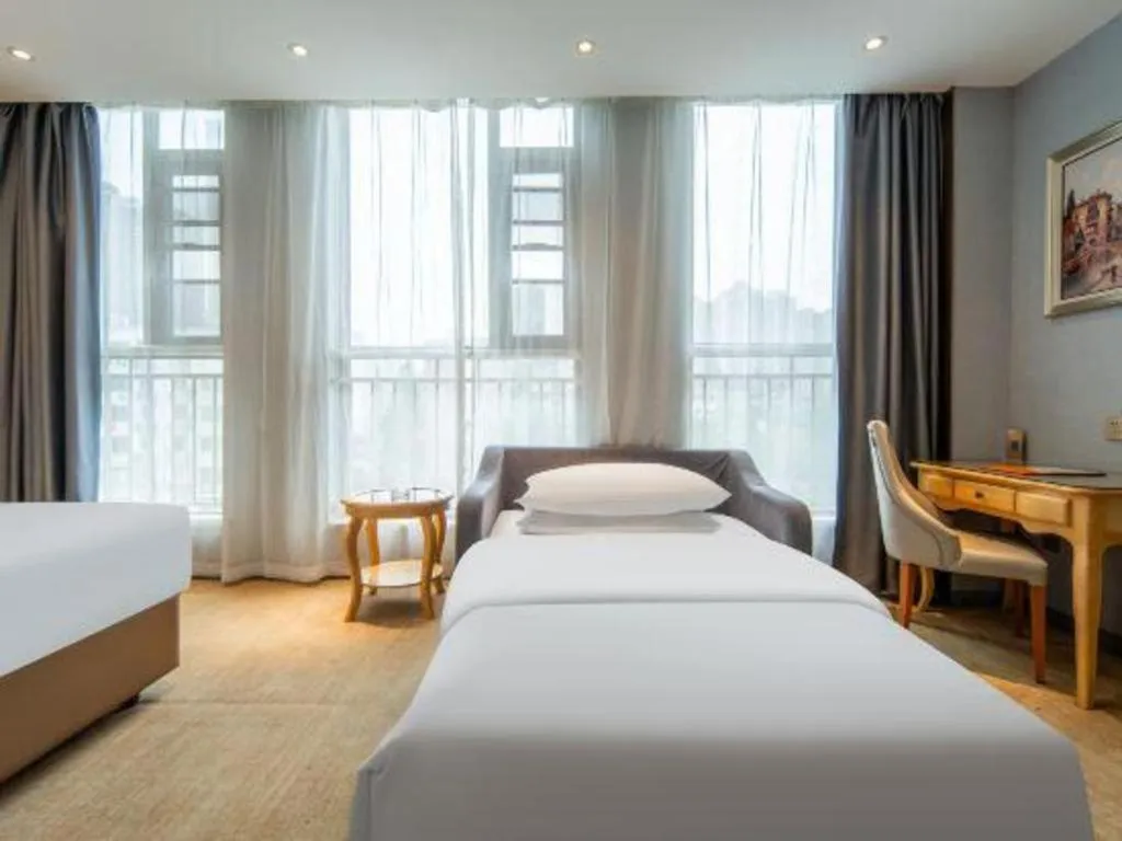 Bed in Vienna Hotel Wuhan Guobo Jiangang Metro Station