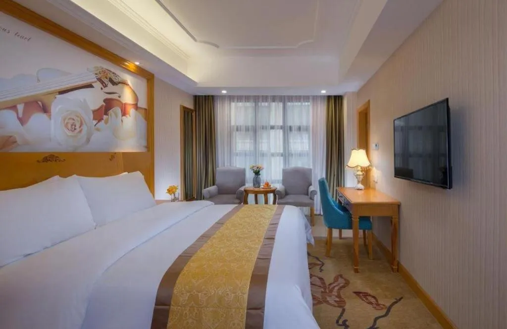 Bed in Vienna Hotel Chongqing Wanzhou Wanda Plaza