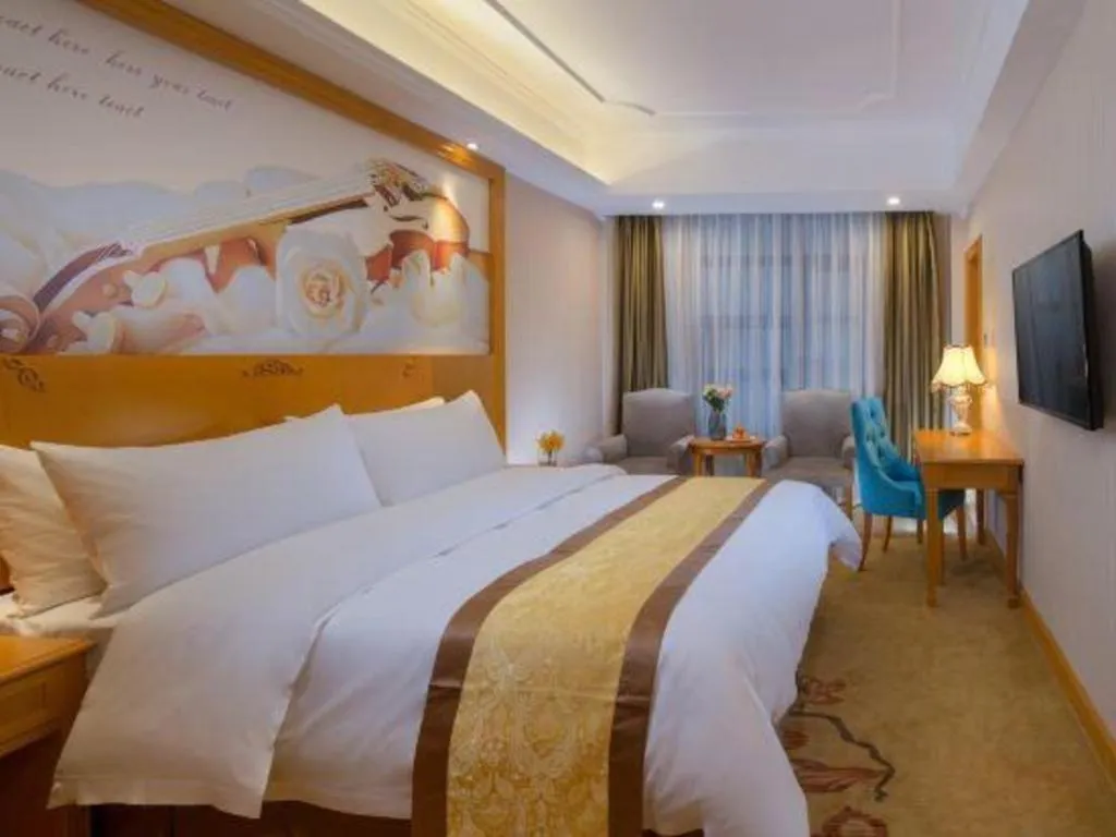Bed in Vienna Hotel Chongqing Wanzhou Wanda Plaza