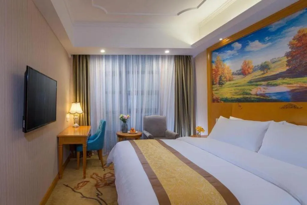 Bed in Vienna Hotel Chongqing Wanzhou Wanda Plaza