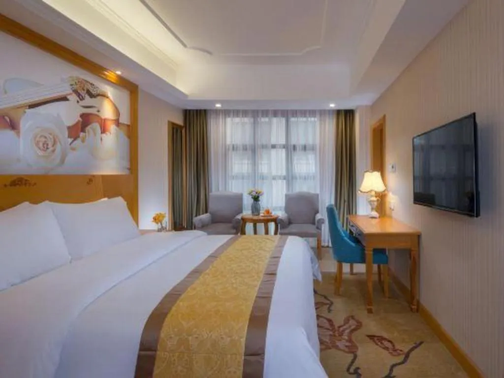 Bed in Vienna Hotel Chongqing Wanzhou Wanda Plaza