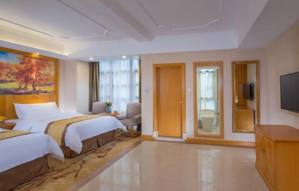 Bed in Vienna Hotel Chongqing Wanzhou Wanda Plaza