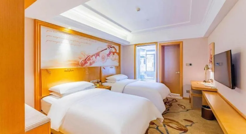 Bed in Vienna Hotel Jilin Dunhua High-Speed Railway Station