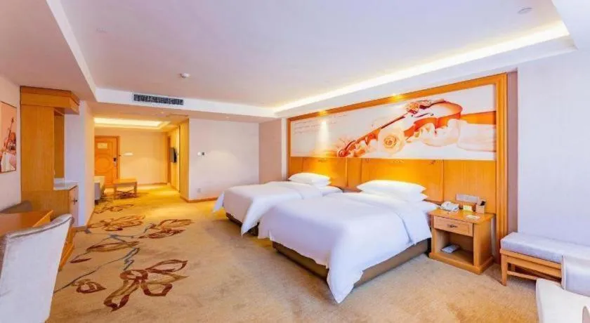 Bed in Vienna Hotel Jilin Dunhua High-Speed Railway Station
