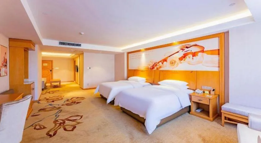 Bed in Vienna Hotel Jilin Dunhua High-Speed Railway Station