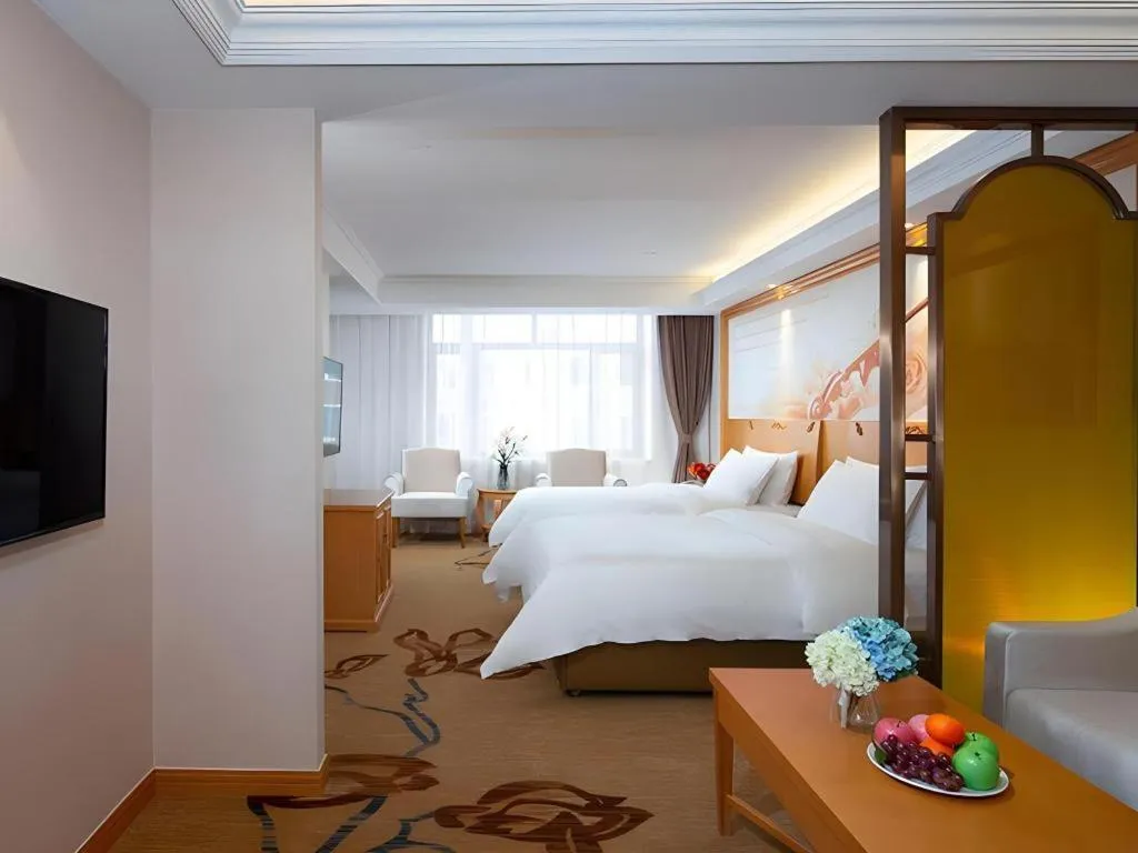 Bed in Vienna Hotel Jilin Dunhua High-Speed Railway Station