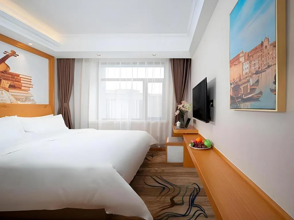 Bed in Vienna Hotel Jilin Dunhua High-Speed Railway Station