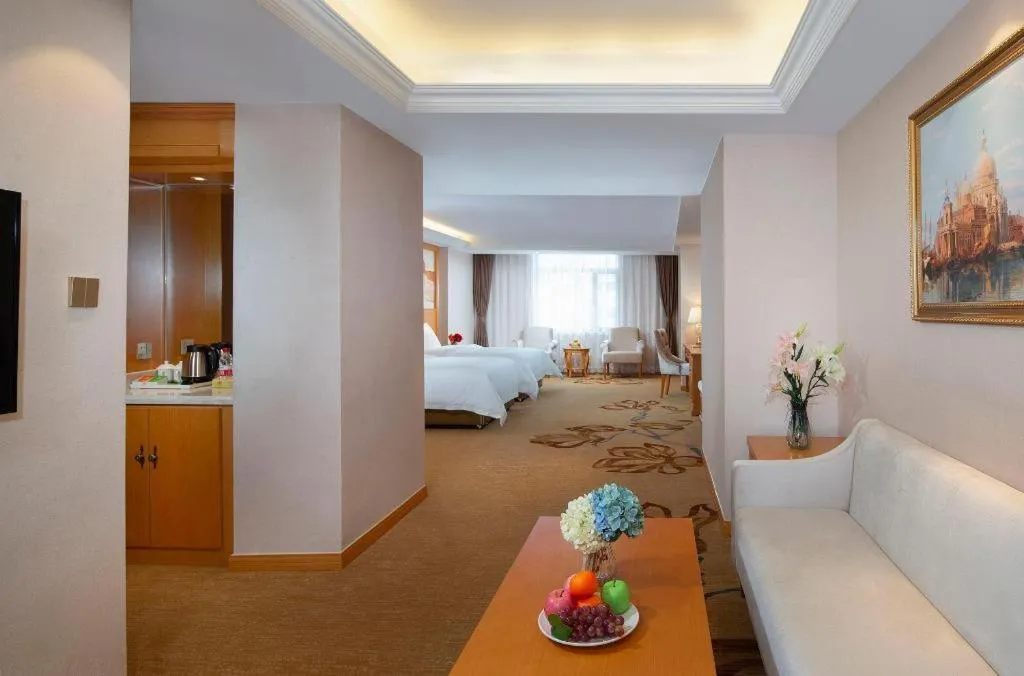 Bed in Vienna Hotel Jilin Dunhua High-Speed Railway Station