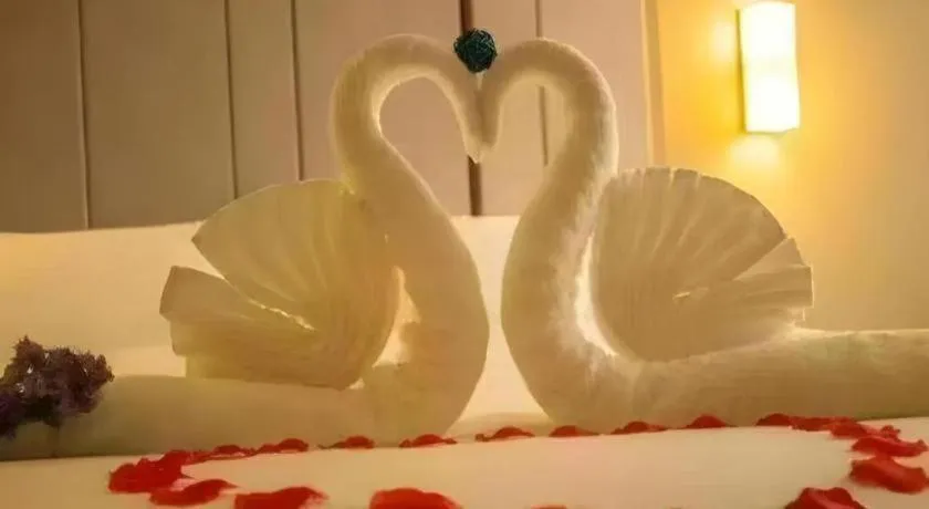 Bed in Vienna Hotel Guangxi Guilin Gongchengtianjie