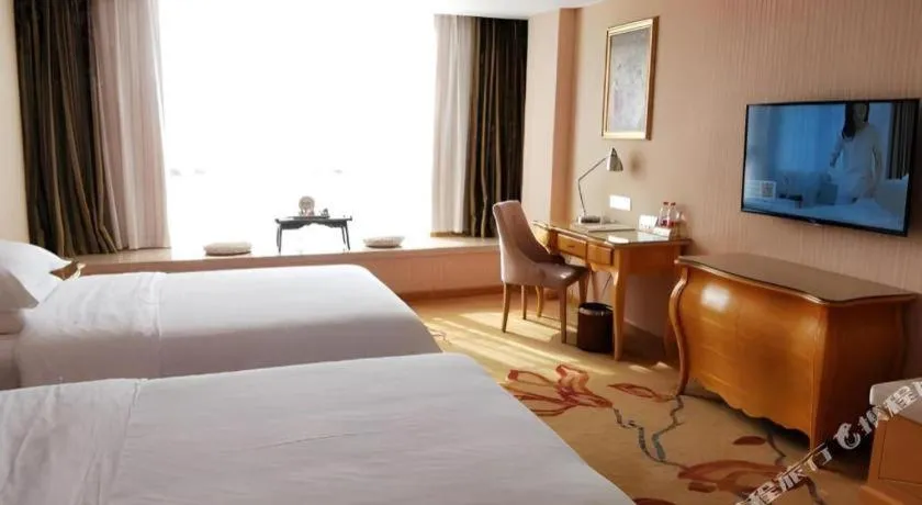 Bed in Vienna Hotel Guangxi Guilin Gongchengtianjie