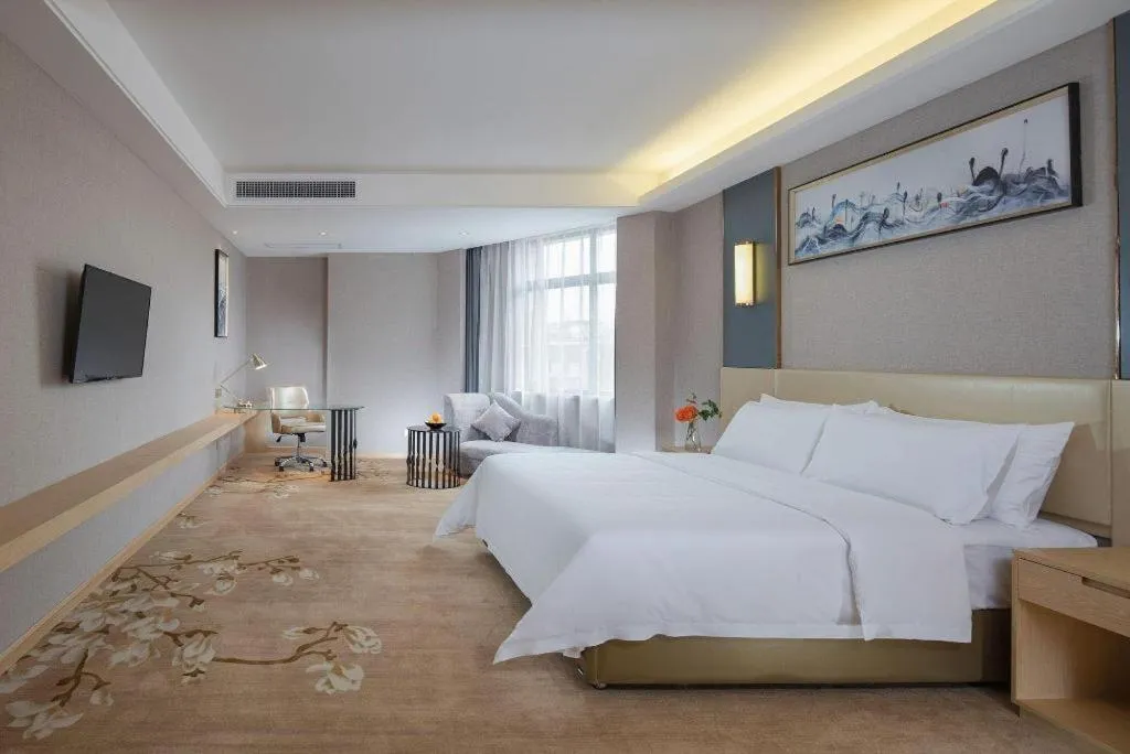 Bed in Vienna Hotel Guangdong Zhongshan Xiaolan High-Speed Railway Station