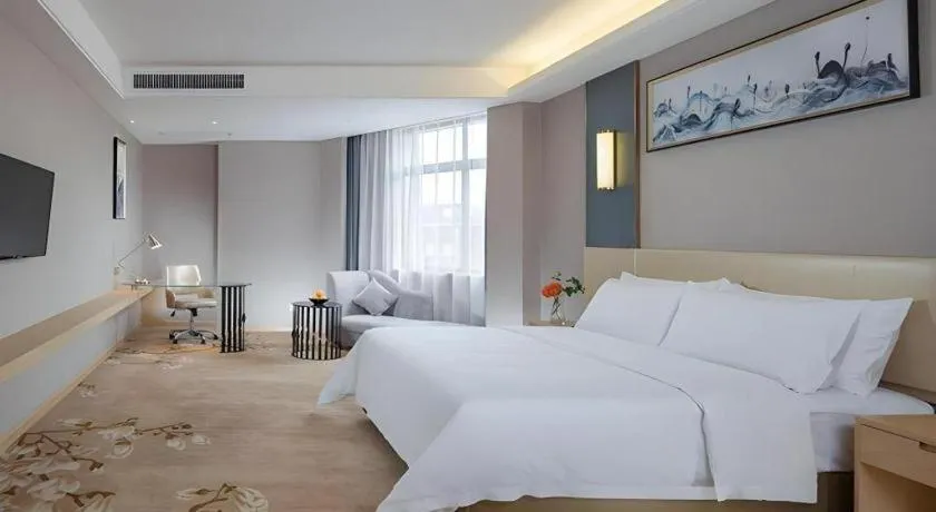 Bed in Vienna Hotel Guangdong Zhongshan Xiaolan High-Speed Railway Station