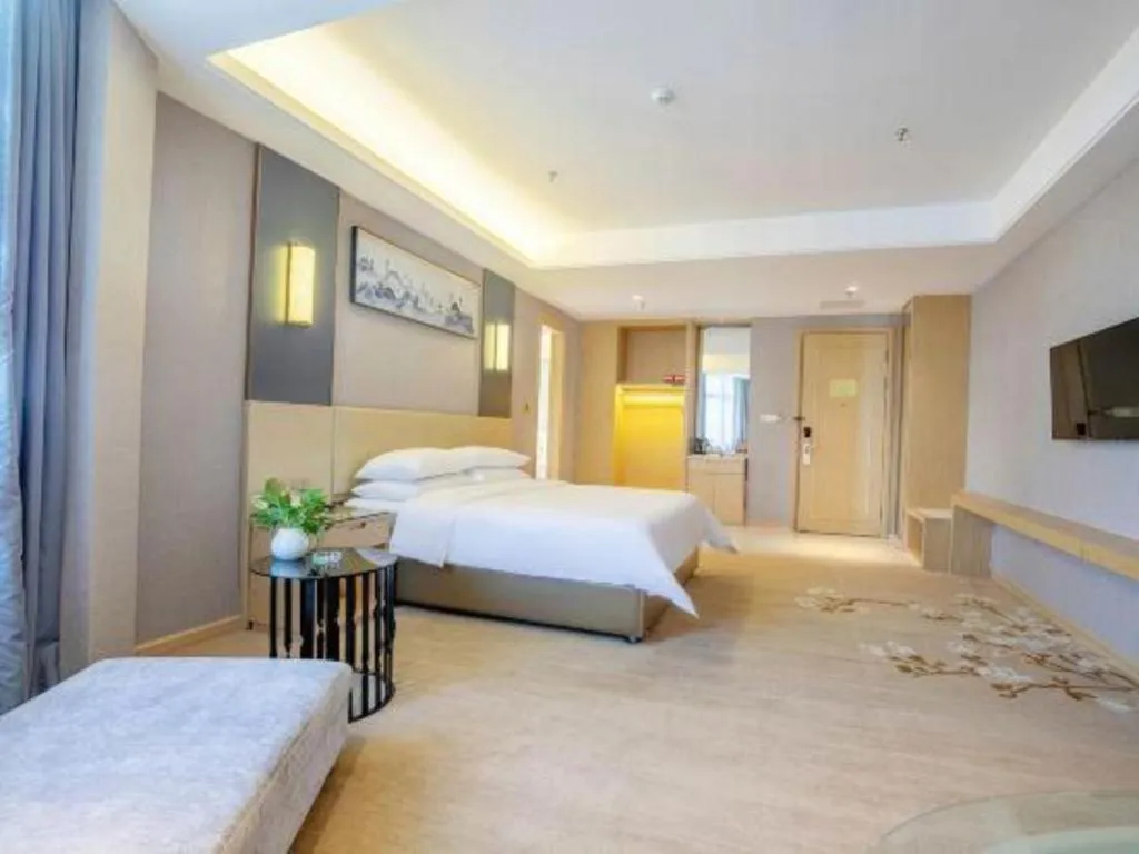 Bed in Vienna Hotel Guangdong Zhongshan Xiaolan High-Speed Railway Station