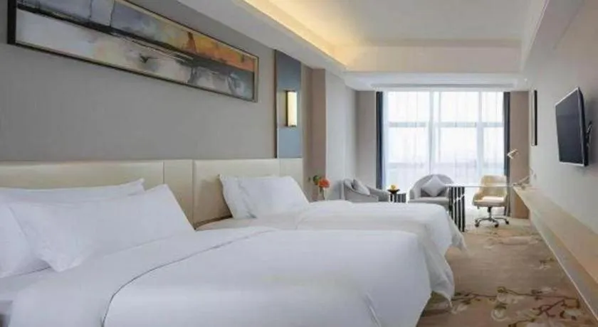 Bed in Vienna Hotel Guangdong Zhongshan Xiaolan High-Speed Railway Station