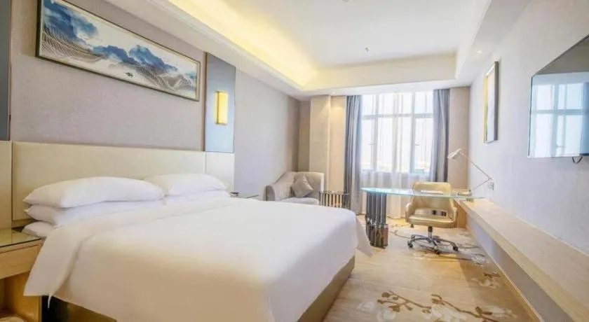 Bed in Vienna Hotel Guangdong Zhongshan Xiaolan High-Speed Railway Station