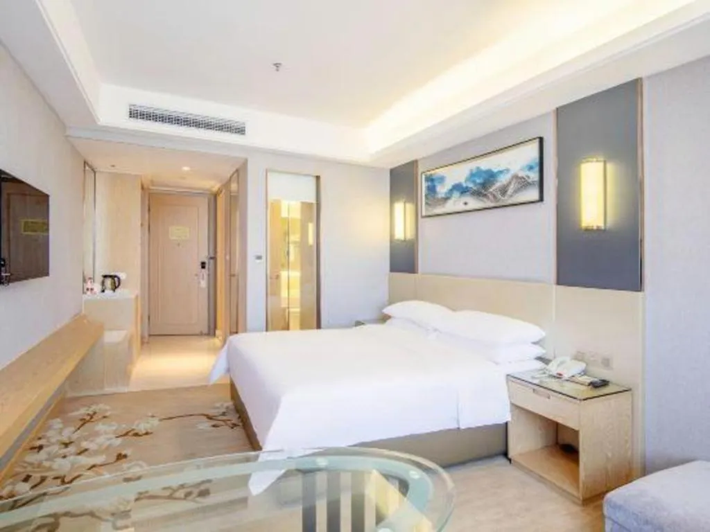 Bed in Vienna Hotel Guangdong Zhongshan Xiaolan High-Speed Railway Station