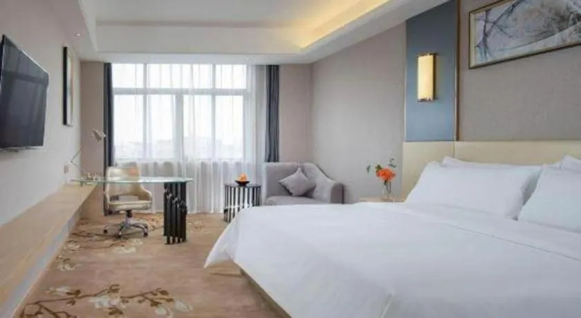Bed in Vienna Hotel Guangdong Zhongshan Xiaolan High-Speed Railway Station