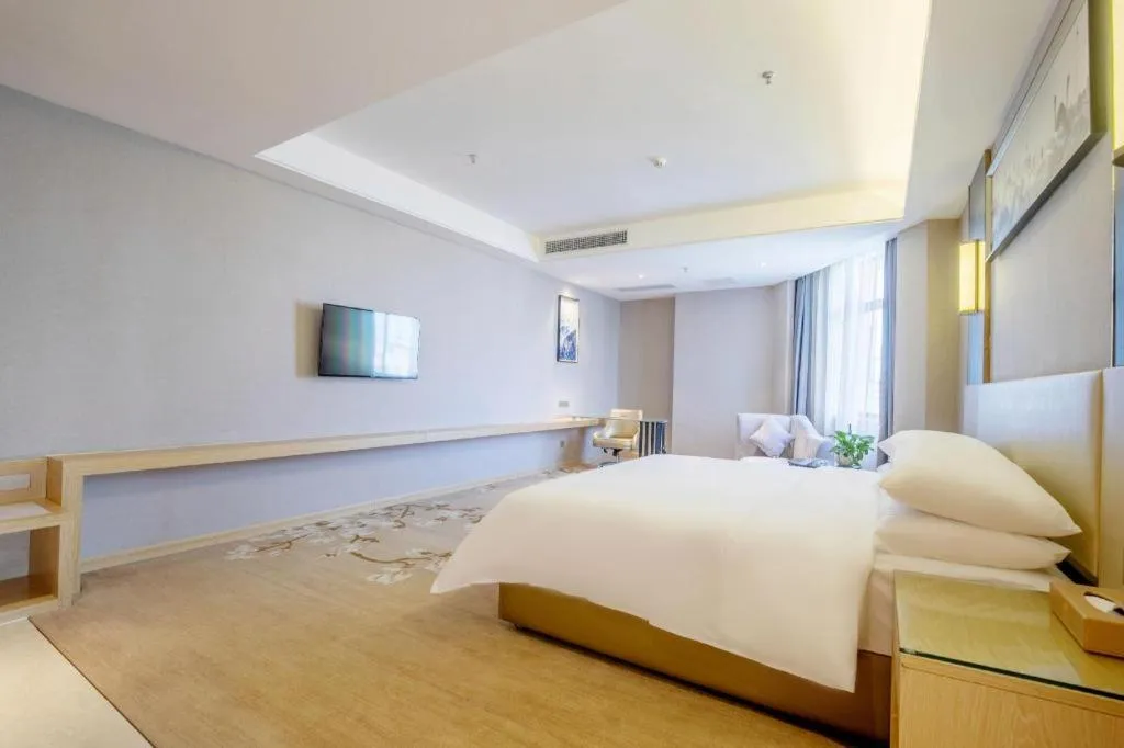 Bed in Vienna Hotel Guangdong Zhongshan Xiaolan High-Speed Railway Station