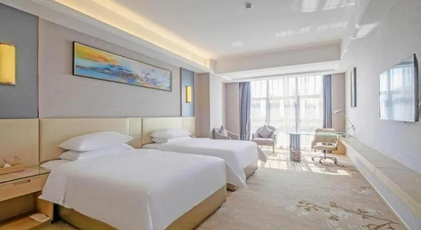 Bed in Vienna Hotel Guangdong Zhongshan Xiaolan High-Speed Railway Station