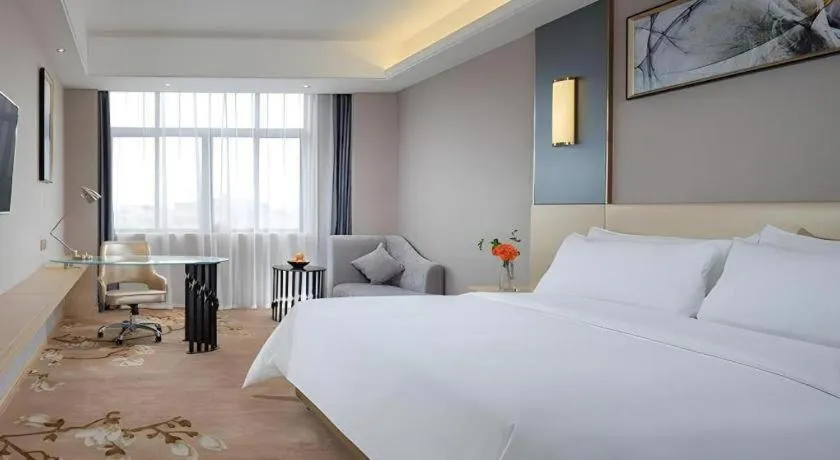 Bed in Vienna Hotel Guangdong Zhongshan Xiaolan High-Speed Railway Station