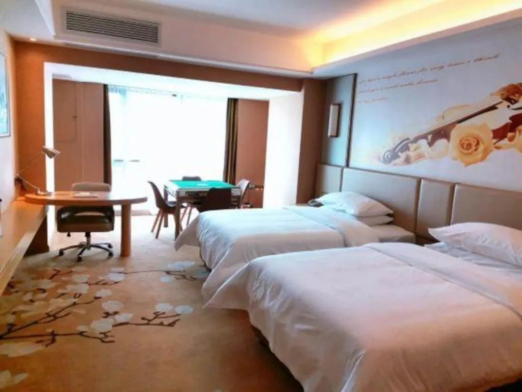 Bed in Vienna Hotel Fuzhou Changle Shouzhan Hangcheng Metro Station