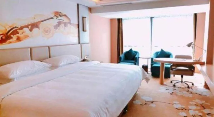 Bed in Vienna Hotel Fuzhou Changle Shouzhan Hangcheng Metro Station