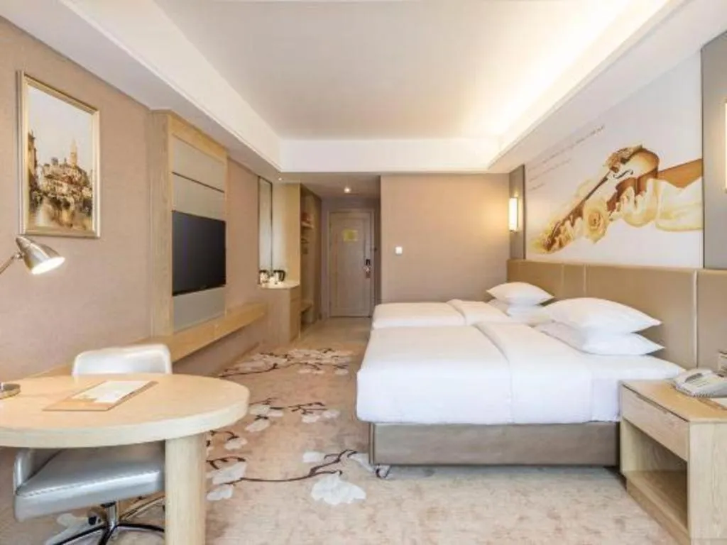 Bed in Vienna Hotel Fuzhou Changle Shouzhan Hangcheng Metro Station