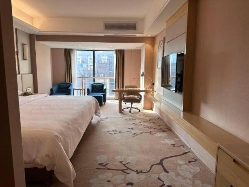 Bed in Vienna Hotel Fuzhou Changle Shouzhan Hangcheng Metro Station