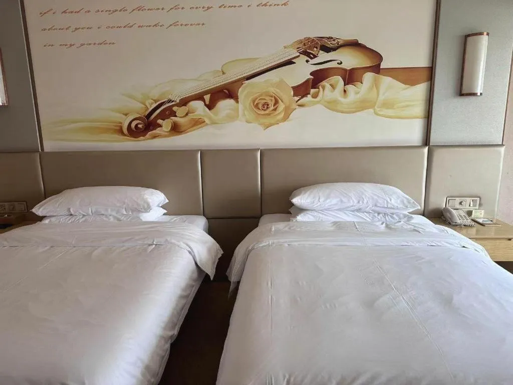 Bed in Vienna Hotel Fuzhou Changle Shouzhan Hangcheng Metro Station