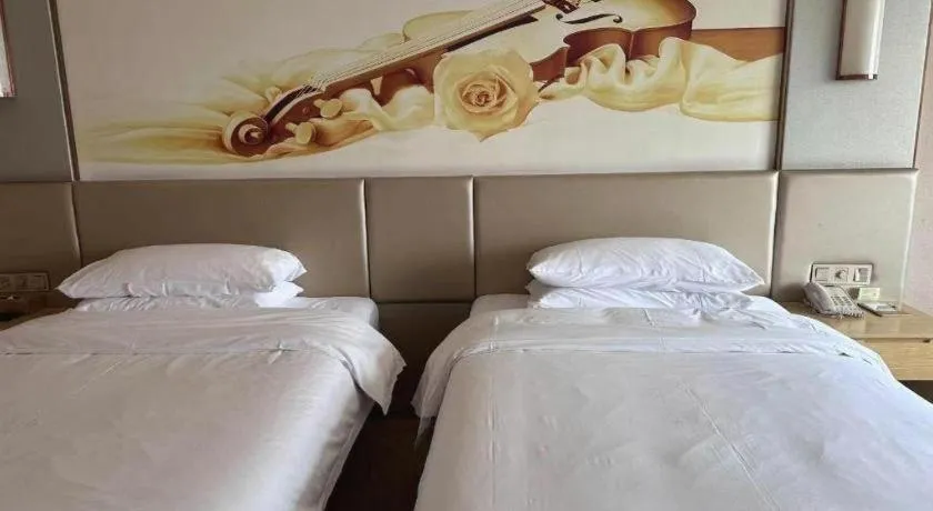 Bed in Vienna Hotel Fuzhou Changle Shouzhan Hangcheng Metro Station
