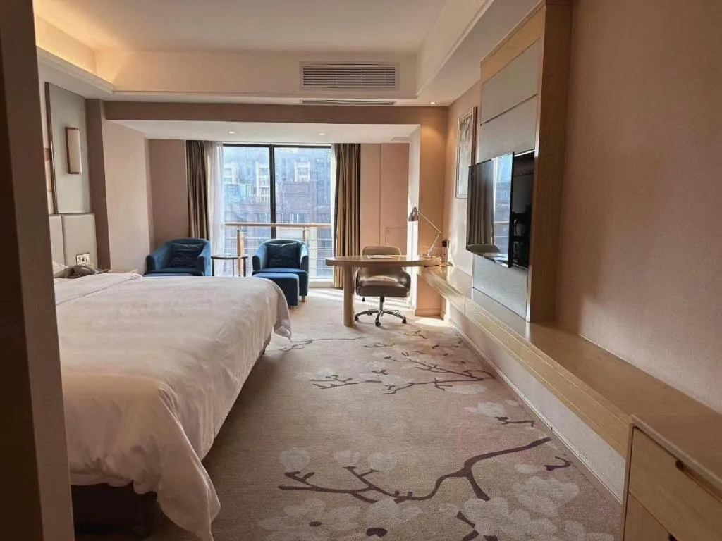 Bed in Vienna Hotel Fuzhou Changle Shouzhan Hangcheng Metro Station