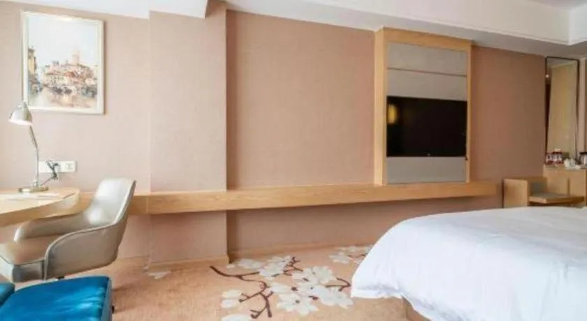 Bed in Vienna Hotel Fuzhou Changle Shouzhan Hangcheng Metro Station