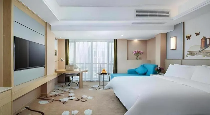 Bed in Vienna Hotel Fuzhou Changle Shouzhan Hangcheng Metro Station