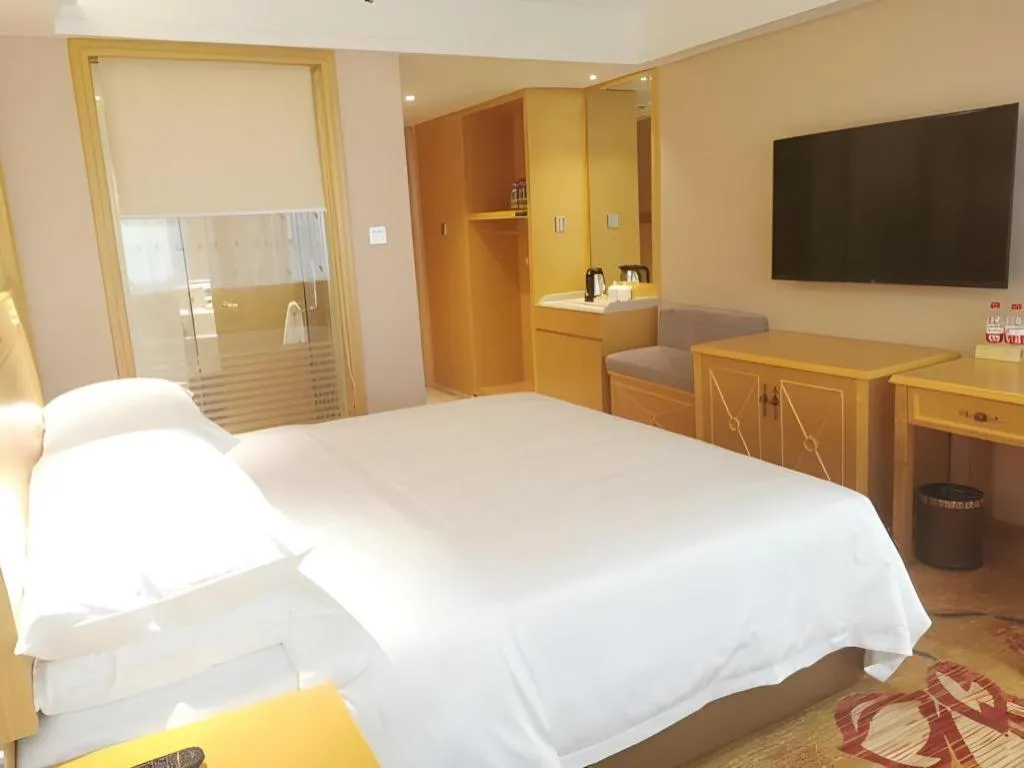 Bed in Vienna Hotel Guangxi Hezhou Guposhan Suifeng