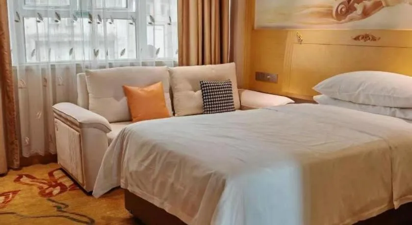 Bed in Vienna Hotel Guangxi Hezhou Guposhan Suifeng