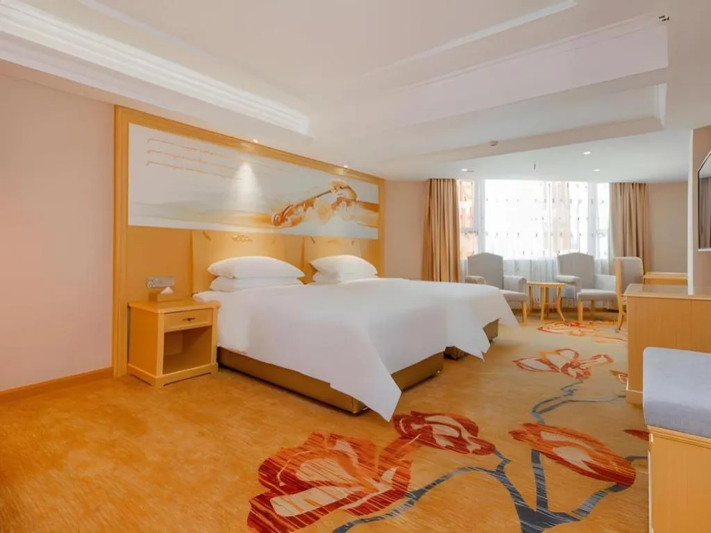 Bed in Vienna Hotel Guangxi Hezhou Guposhan Suifeng